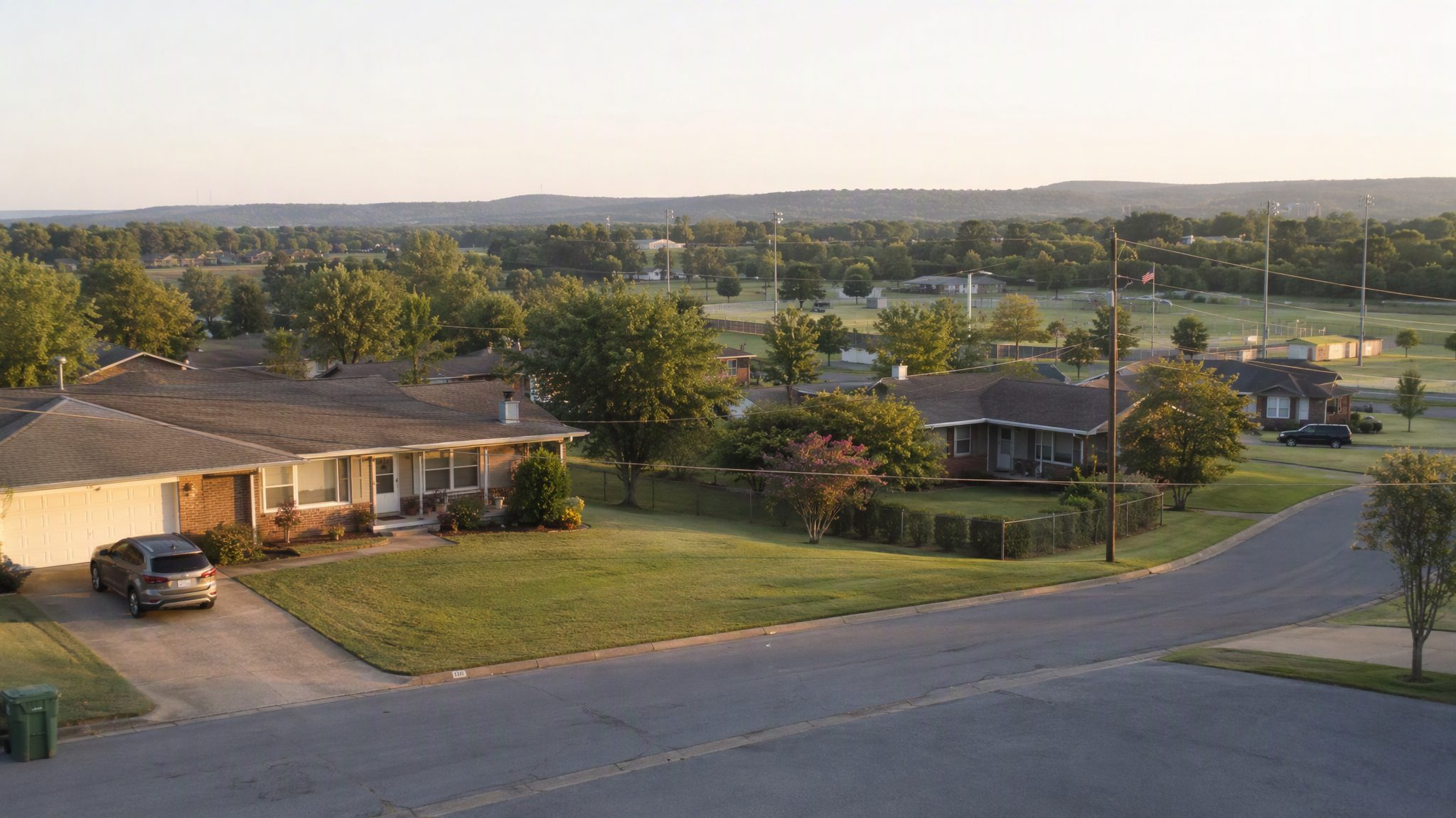 Established ranch homes on a quiet residential street in Springdale, Arkansas